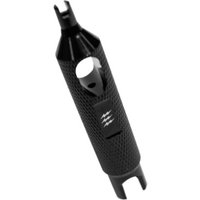 Black Muc-Off valve core remover with textured grip and dual-ended design for easy valve core removal.