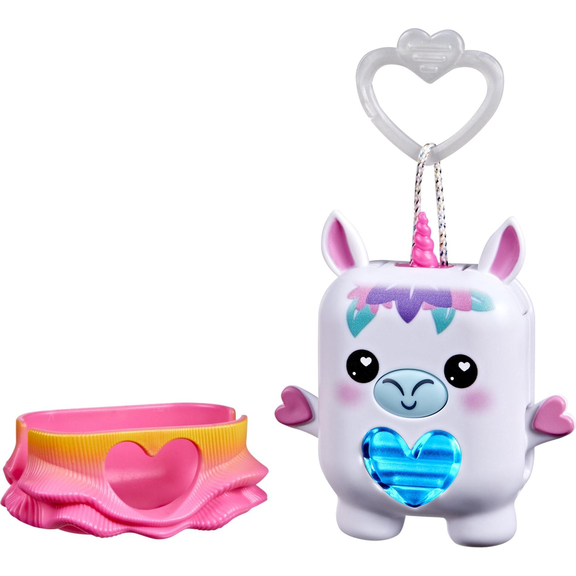 White electronic pet shaped like a unicorn with a pink horn and heart-shaped blue light, accompanied by a pink base with a ruffled edge and heart cutout.