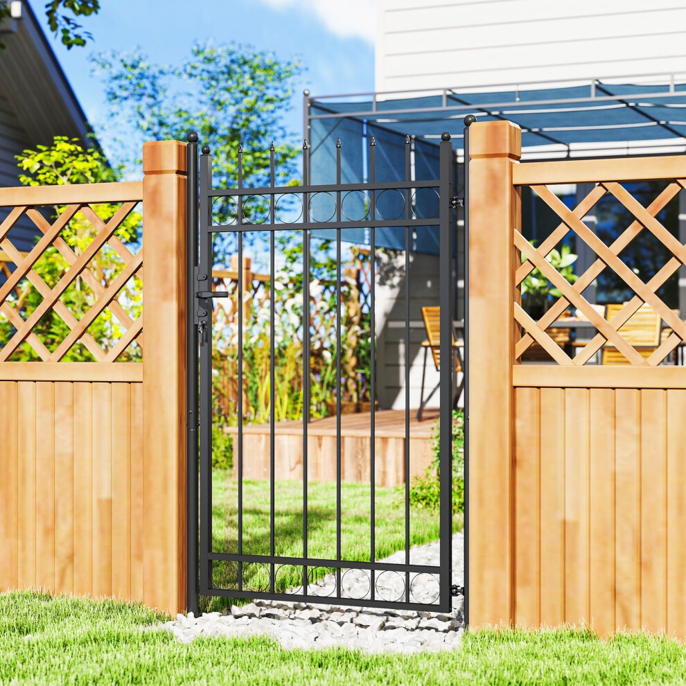 Galvanised steel garden fence gate in black, featuring a secure lock and keys, framed by wooden fencing with lattice design, set in a vibrant garden.