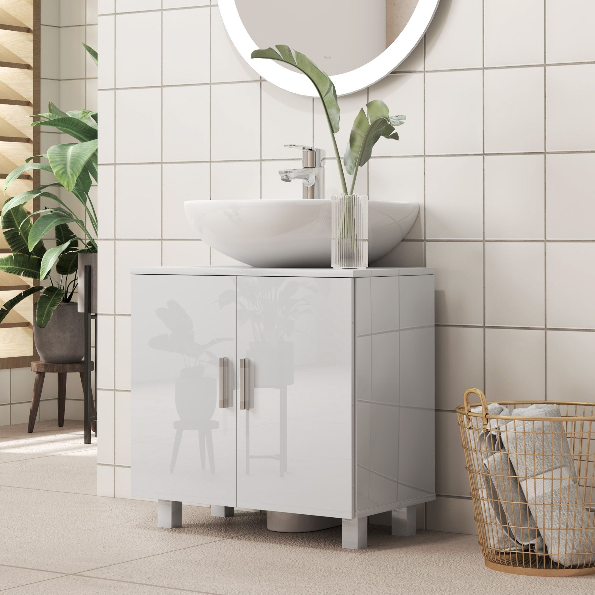 Freestanding white high gloss under sink cabinet with two doors, sleek design, and modern legs, complemented by a round mirror and a white basin atop, surrounded by greenery.