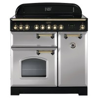 Classic 90cm ceramic range cooker in Royal Pearl with brass trim, featuring a sleek design, multiple control knobs, and a large oven window.