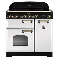 Classic 90cm ceramic range cooker in white with brass trim, featuring an elegant black control panel, six knobs, a large oven door, and a side compartment.