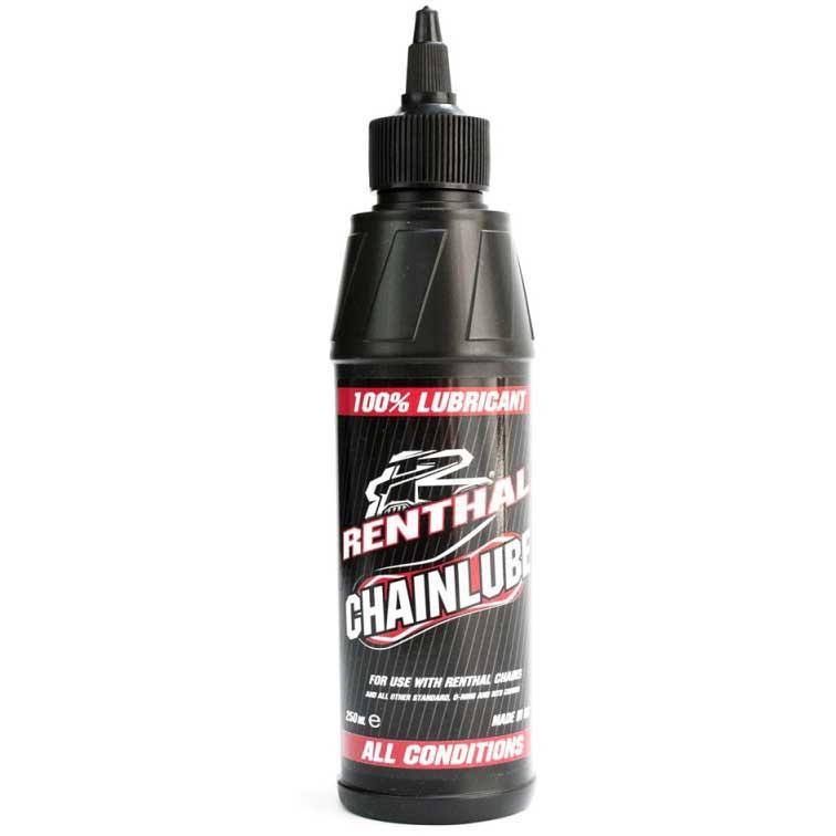 Black bottle of Renthal Chain Lube with a pointed nozzle, featuring a bold red and white label stating "100% Lubricant" and "All Conditions," designed for motorcycle chain maintenance.