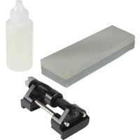 Roughneck Chisel Sharpening Kit with gray sharpening stone, black honing guide, and clear oil bottle.