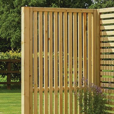 Vertical slat panel fencing made from pressure-treated natural wood, featuring evenly spaced slats, ideal for garden boundaries or privacy, with a light wood finish.
