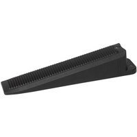 Black plastic Delta Level System wedge with ribbed surface and tapered design by RUBI TILING TOOLS.