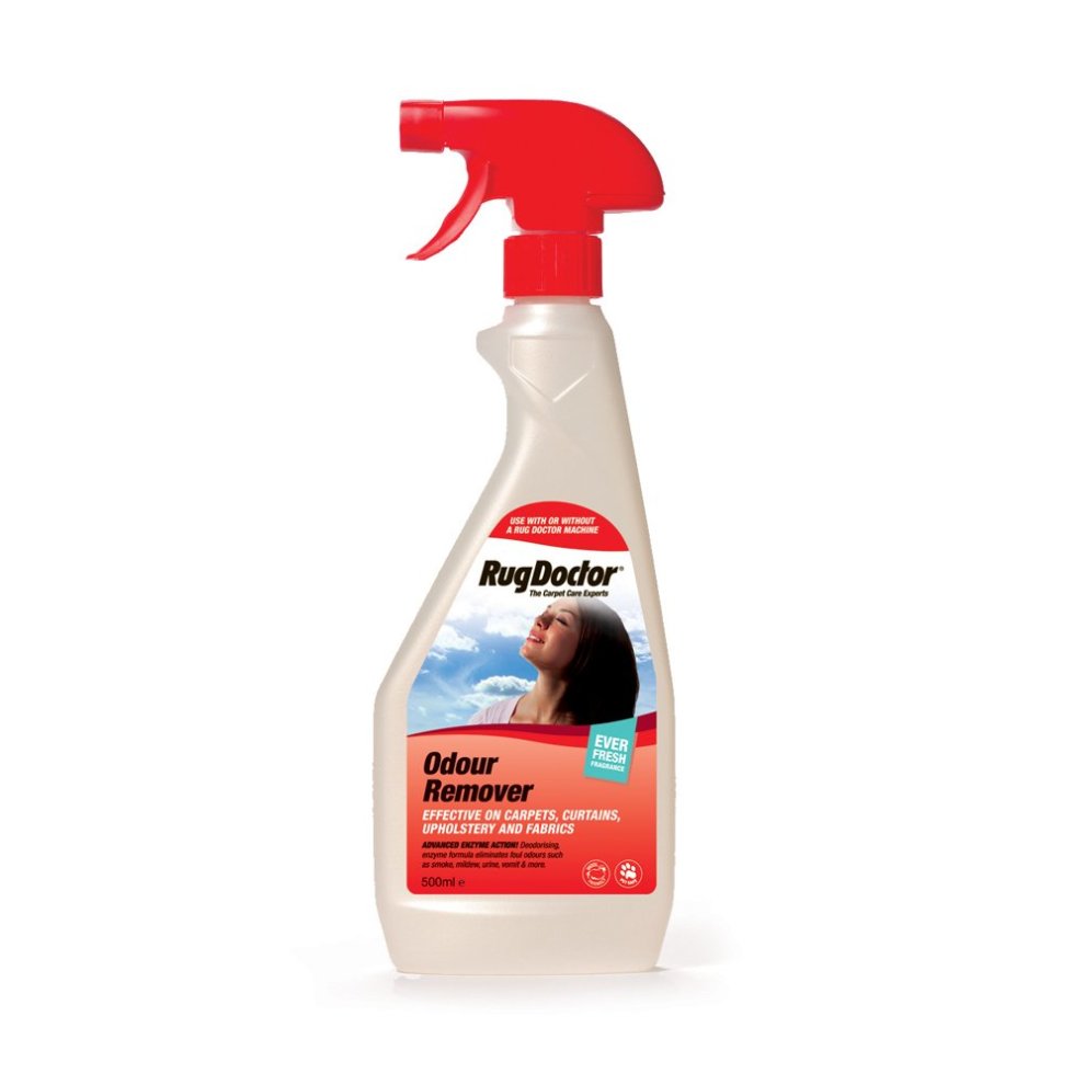 Clear plastic spray bottle with a red trigger nozzle, labeled "Rug Doctor Odour Remover," 500 ml, designed for carpets, curtains, upholstery, and fabrics.