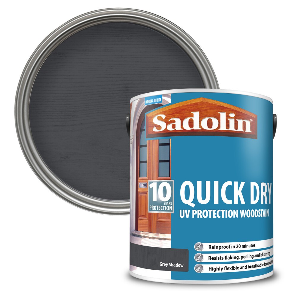 Grey Shadow Sadolin 10 Year Quick Dry Woodstain in a 5L tin, featuring a blue label with white text, showcasing UV protection and quick drying properties, with a dark grey stain visible inside.