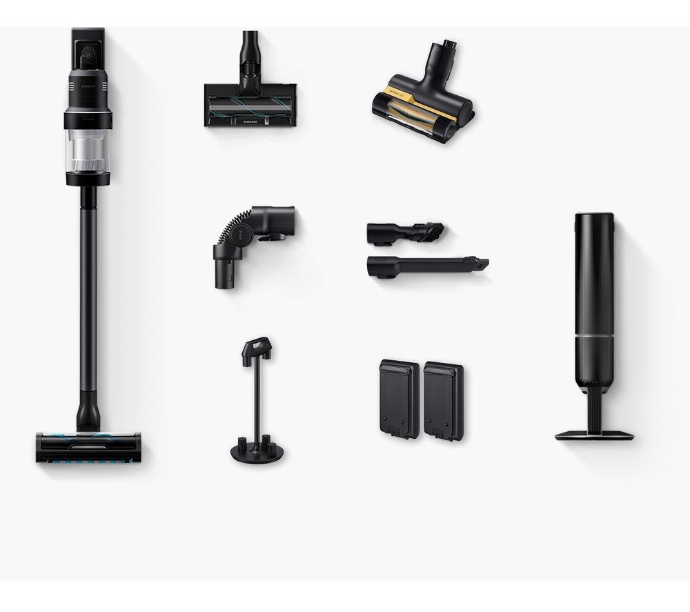 Samsung Bespoke Jet™ AI Cordless Stick Vacuum Cleaner in sleek black, featuring various attachments including a motorized brush, crevice tool, and two batteries, all arranged neatly.