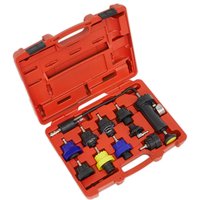 Red Sealey 10 Piece Cooling System Pressure Test Kit with various adapters and a pressure gauge in a molded case.