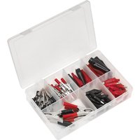 Clear plastic box with assorted red and black crocodile clips in various sizes and styles, organized in compartments.