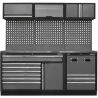 Modular storage system with stainless steel worktop, black frame, multiple drawers, cabinets, and perforated back panel.