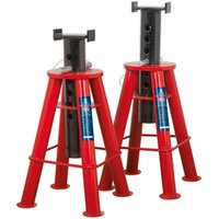 Red heavy-duty axle stands with adjustable height and safety pins, featuring a wide base for stability.
