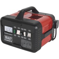 Red and black Sealey CHARGE112 automotive battery charger with handle, analog display, and control switches.