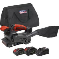 Sealey cordless belt sander with red handle, black dust bag, two batteries, charger, and black carrying case.