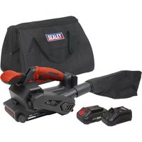 Black and red Sealey cordless belt sander with dust bag, two 20V batteries, charger, and black carrying case.