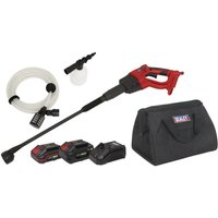 Red and black Sealey cordless pressure washer with hose, nozzle, two 20V batteries, charger, and black carrying bag.