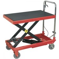 Red Sealey hydraulic scissor lift table with black platform, chrome handle, and four caster wheels.