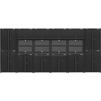 Black Sealey modular garage storage system with multiple cabinets, drawers, and a central workbench area.