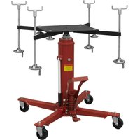 Red Sealey transmission jack with black subframe cradle, hydraulic lift, and four adjustable support arms on wheels.