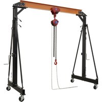Black and orange portable lifting gantry crane with adjustable height, two-tonne capacity, and integrated hoist.
