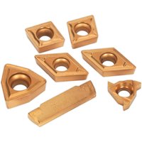 Sealey SM3025CS5 lathe turning tool tips set, gold-colored, various geometric shapes with central holes.