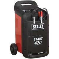 Red and black Sealey START420 heavy-duty starter/charger with wheels, handle, and attached jumper cables.