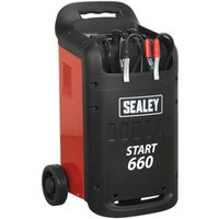Red and black Sealey START660 heavy duty starter/charger with wheels, handle, and attached cables.