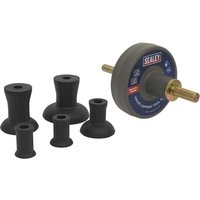 Sealey valve lapping tool kit with multiple black rubber attachments and a central rotating disc with Sealey logo.