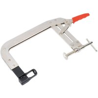 Sealey valve spring compressor with silver metal frame, red handle, and adjustable clamp mechanism.