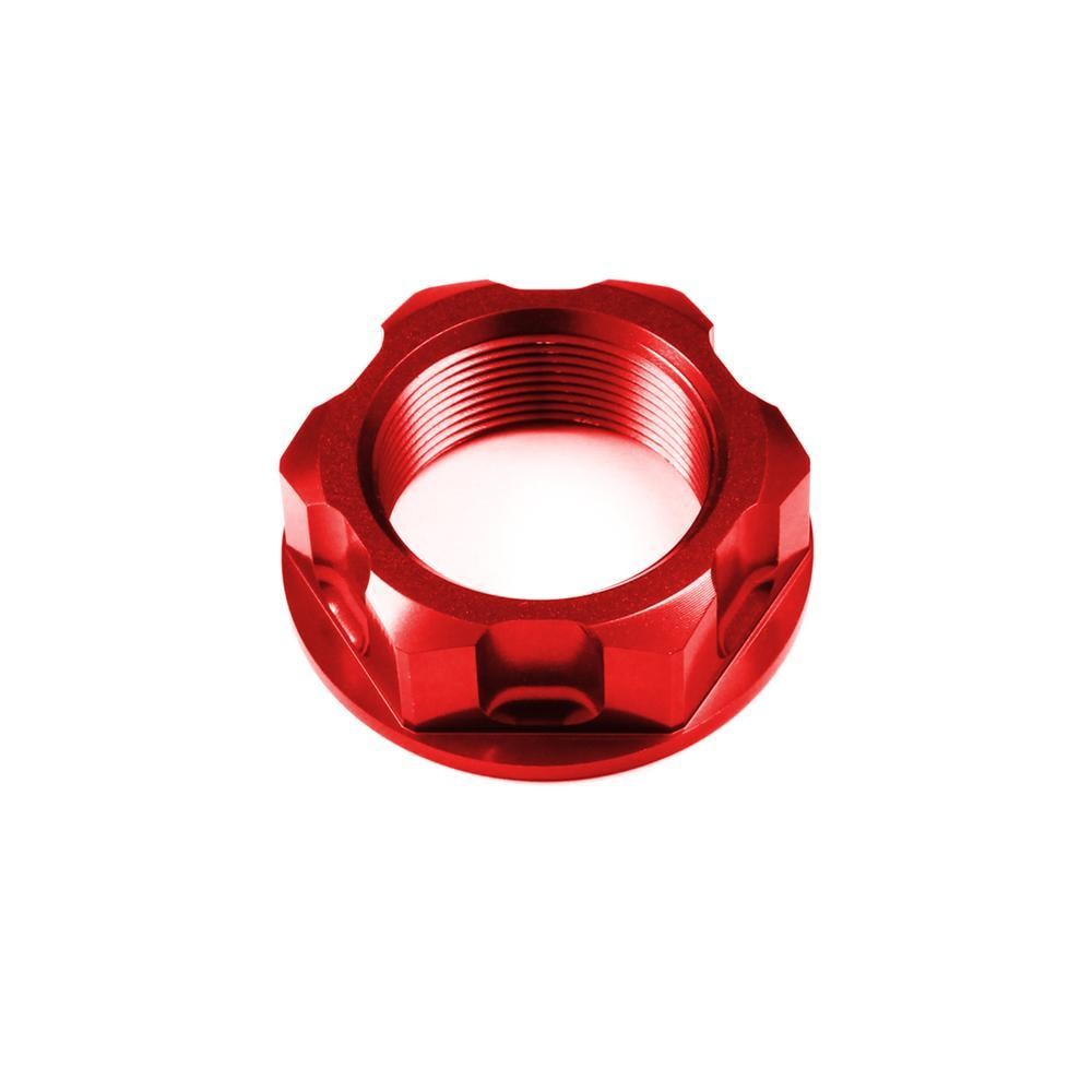 Bright red aluminum steering stem nut with a hexagonal design, featuring precise threading for secure fitment on various motorcycle models including Honda, Suzuki, and Yamaha.
