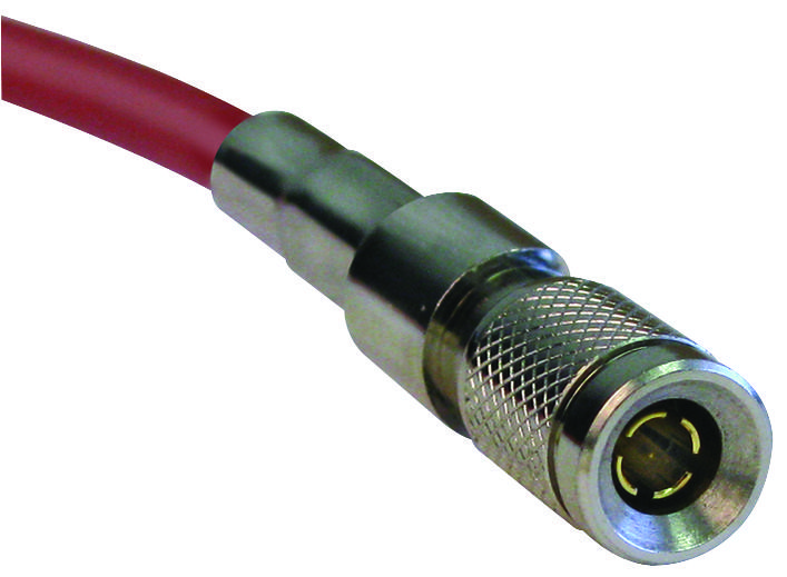 Red coaxial cable with a metallic connector featuring a knurled grip and a gold-plated inner pin, designed for RF applications.