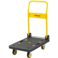 Yellow and black Stanley folding platform truck with four wheels and a textured surface.