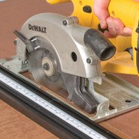 Circular saw blade, 165mm, 24 teeth, silver, with 15.88mm bore, displayed on a yellow DeWalt saw.