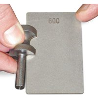 Double-sided diamond stone credit card sharpener with gray surface and "600" grit marking.