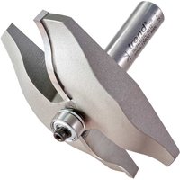 Trend large bearing guided ogee panel raiser router cutter with silver metallic finish and sharp curved edges.