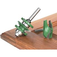 Green and silver Trend panel door set with ogee design, featuring two router bits on a wooden surface.