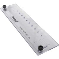 Clear acrylic Trend shelf support template with 32mm center holes and black knobs.