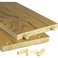 Wooden dowels by Trend, light wood color, shown inserted into two laminated wood boards with visible grain pattern.