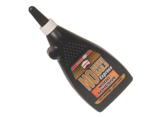 Black plastic bottle with a pointed nozzle, labeled "No More Nails Express Wood Adhesive" in bold white and gold text, featuring a textured grip for easy handling.