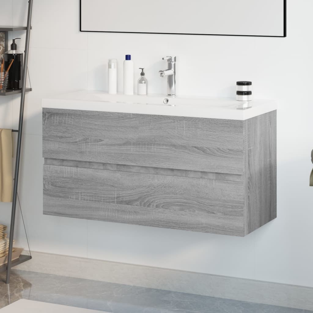 Grey Sonoma engineered wood sink cabinet featuring a sleek built-in basin, two smooth drawers, and a modern faucet, perfect for contemporary bathroom spaces.
