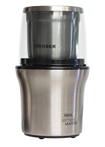 Silver electric grinder with a transparent lid, featuring a stainless steel grinding bowl, labeled "GRINDER," and branded with "Wahl James Martin" on the base.