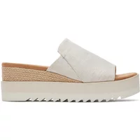 White TOMS Diana wedge mules with open toe, woven jute detail, and textured platform sole.