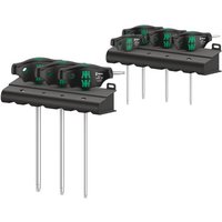 Wera 7-piece T-handle screwdriver set with black and green ergonomic handles and metal rack holder.