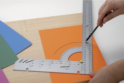 Silver metal try square with a 45° stop, featuring measurement markings and a pencil being used on colorful paper and wood surfaces.