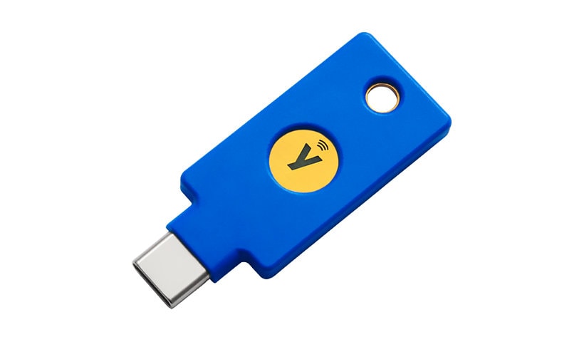 Blue USB-C security key with a yellow circular logo featuring a checkmark, designed for 2-factor authentication, compatible with NFC and FIDO U2F/FIDO2 standards.