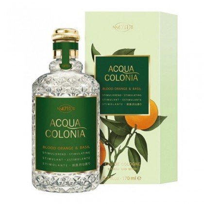 Clear glass bottle with a textured design, green cap, and gold accents, accompanied by a green and orange box featuring an orange and basil illustration.
