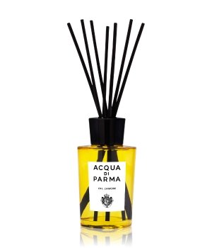 Yellow glass diffuser bottle with black reeds, featuring a white label with black text reading "Acqua Di Parma" and a logo, elegantly designed for home fragrance.