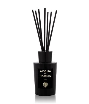 Black glass room diffuser with a sleek design, featuring a black cap and several black reeds, labeled "Acqua Di Parma Oud" in elegant white font.