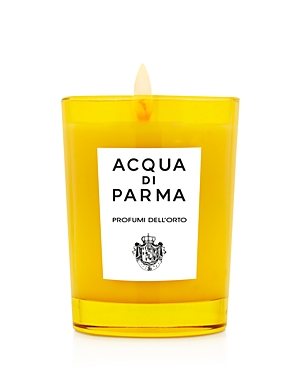 Bright yellow glass candle with a white label featuring "ACQUA DI PARMA" and "PROFUMI DELL'ORTO" text, topped with a small flame.